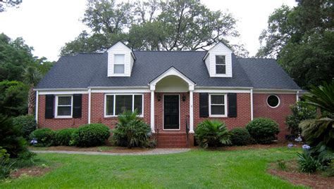 red brick house with black metal roof|metal roofs on brick houses.